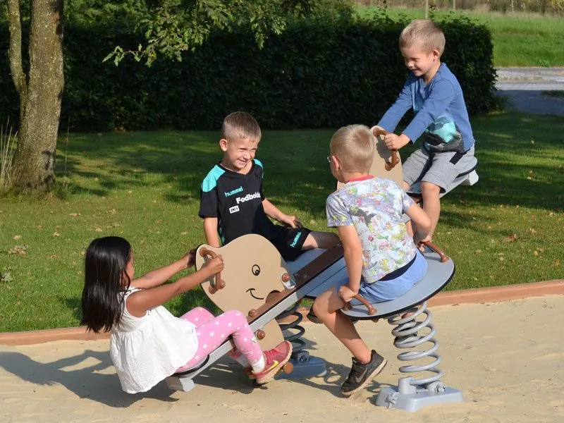 Spring seesaw elephants with 4 bouncing children Spring seesaw elephants with 4 bouncing children